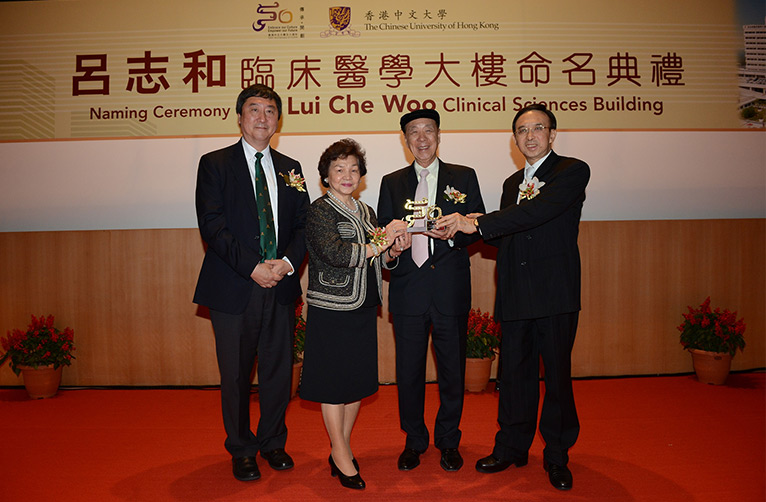 Dr. Vincent CHENG (right) presents a CUHK 50th anniversary souvenir to Dr. LUI Che Woo.